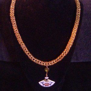 Hand Crafted Tubular  Gold beaded necklace with a white fan center